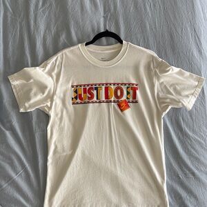 Nike Cream T-Shirt with Vibrant Graphic